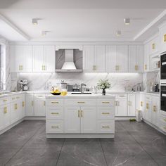 a large kitchen with white cabinets and marble counter tops, gold trimmings on the doors