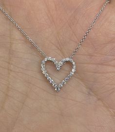 "Dainty Diamond Heart Necklace White Gold. This stylish heart necklace has a very pretty shape. The diamonds are very sparkling. Excellent craftsmanship, so lays nicely on; won't flip around. Great for layering with other necklaces also. The diamonds are clean even when viewed under a magnifying glass. The heart measures 13.5 x 13mm. The strong white gold chain included is 16\". Genuine round brilliant cut diamonds Total weight: 0.30 Carats Clarity: SI Color: G 18K White Gold pendant 14K White G Dainty Heart Necklace, Pendant Necklace Diamond, Diamond Heart Necklace, Gold Heart Pendant, Gold Link Chain, Heart Necklace Diamond, Heart Pendant Gold, White Gold Chains, Necklace Diamond