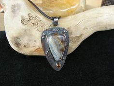 Beautiful Blue Agate and Citrine Pendant Necklace. The Pendant is entirely Handmade in Sterling Silver with 14K gf accents and patina'd for an antique appearance.  The stones are also self collected from nature and I do the lapidary work myself.  The blue agate (this specimen has pale blues, purples, yellow, and black/browns) is from a seam of agate called the "Jr Vein" located in Skagit County in Washington State, the black/brown inclusions in this agate are Marcasite.  Amazingly, the Citrine w Citrine Pendant, November Birthstone, Necklace Necklace, Jewelry Gemstone, Blue Agate, Handmade Pendant, Handmade Necklace, Leather Necklace, Necklace Handmade