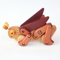 a wooden toy that is shaped like a bear