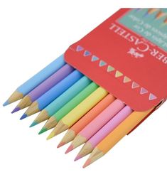 colored pencils are lined up in a red box with a label on the top