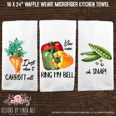 three kitchen towels with different vegetables on them