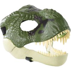 a green dinosaur mask with white teeth