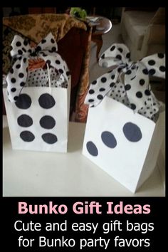 two white bags with black polka dots on them and the words bunko gift ideas cut and easy gift bags for bunko party favors