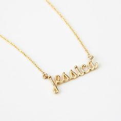 Script Name 14K Gold Necklace Adorn yourself with this 14K Gold Script Name Necklace, a perfect blend of personalization and style. Customizable for women, it's more than just a piece of jewelry; it's a statement of identity. This dainty 14k yellow gold necklace, makes an excellent personalized gift, elevating your elegance and charm. With its timeless design, it's a valuable addition to your jewelry collection, enhancing your style and personality. You'll have: 14k solid gold handcrafted neckla Customizable Elegant White Gold Name Necklace, Elegant Customizable Gold Plated Necklaces, Elegant Customizable Gold Plated Jewelry, Elegant Customizable Gold-plated Jewelry, Personalized Dainty 14k Gold Necklace, Delicate Personalized Yellow Gold Name Necklace, Dainty 14k Gold Personalized Gift Necklace, Dainty 14k Gold Custom Necklace For Personalized Gift, Personalized Delicate Yellow Gold Name Necklace