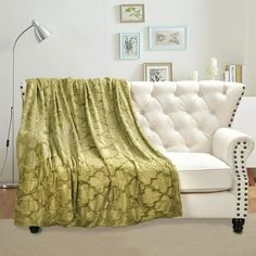 a couch with a green blanket on top of it