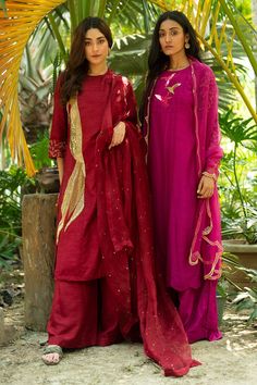 Maroon paneled A-Line kurta with hand embroidery. Comes with palazzo and a dupatta.
Component: 3
Pattern: Hand embroidered
Neckline: Round
Sleeve Type: Three quarter
Fabric: Dola silk, Organza
Color: Maroon
Other Details: 
Embroidered sleeves
Attached lining
Note : Outfit worn by the model on the right is not for sale.
Occasion: Mehendi and Haldi, Puja - Aza Fashions Transitional Zari Work Dresses, Semi-stitched Raw Silk Dresses, Raw Silk Dresses With Dupatta, Festival Dresses With Cutdana Detail, Chanderi Dresses With Dupatta, Anarkali Dresses With Gota Work, Festive Raw Silk Dresses, Semi-stitched Chanderi Dresses, Georgette Cutdana Dresses