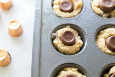 some cupcakes that are in a muffin tin