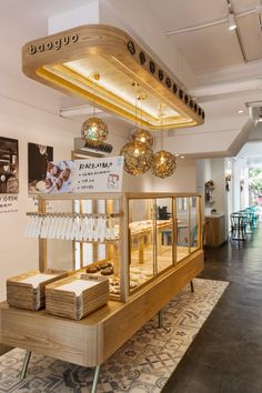 the interior of a bakery with lots of food on display