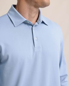 Versatility is the name of the game with this long-sleeve performance polo. The button-down design adds a refined look, while the internal collar stays put. Plus it's crafted with stretch-infused material for maximum comfort and a drop-tail hem for a polished look. This long-sleeve polo is a your new go-to whether you're meeting in the boardroom or teeing up on the green. Style: 11104 Fitted Long Sleeve Polo Shirt For Formal Occasions, Fitted Long Sleeve Golf Tops, Fitted Long Sleeve Tops For Golf, Fitted Long Sleeve Polo Shirt For Golf, Long Sleeve Cotton Polo Shirt For Golf, Cotton Long Sleeve Polo Shirt For Golf, Classic Long Sleeve Golf Top, Classic Long Sleeve Solid Polo Shirt, Classic Collared Polo Shirt With 4-way Stretch