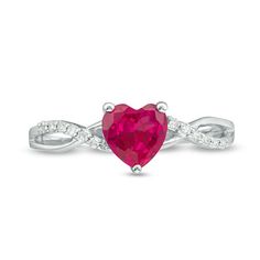 Add an elegant pop of color to your favorite looks with this beautiful fashion ring. Crafted in cool 10K white gold, this graceful design features a 6.0mm heart-shaped lab-created bright red ruby. The split shank glistens with twisted polished and sparkling diamond-lined ribbons. Captivating with 1/20 ct. t.w. of diamonds and a brilliant buffed luster, this ring elevates any attire. White Gold Birthstone Ring For Valentine's Day, Valentine's Day White Gold Diamond Ring With Gemstone, Valentine's Day White Gold Birthstone Ring, White Gold Diamond Birthstone Ring For Valentine's Day, 14k White Gold Heart Cut Rings, Anniversary Heart Cut Ruby Ring In White Gold, Valentine's Day White Gold Diamond Birthstone Ring, White Gold Birthstone Ring With Heart Cut For Promise, White Gold Ruby Promise Ring In Heart Shape