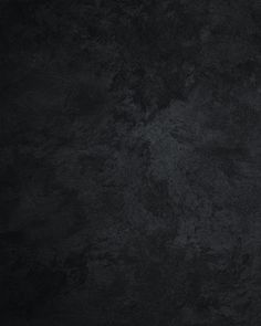 an image of a black textured background that looks like something out of the dark