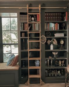 a book shelf with many books and other items on it