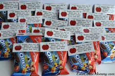 several bags of candy with apple slices on them and some words written in each bag