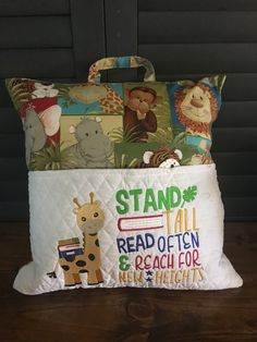 two pillows are stacked on top of each other in front of a black wall with the words stand fail read often and reach for new heights