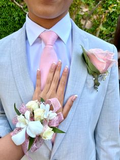 Pink And Gold Prom Couple, Pink And Grey Homecoming Couple, Tux For Pink Prom Dress, Pink Homecoming Outfits For Guys, Light Pink Prom Dress With Grey Suit, Pink Homecoming Corsage, Pink Prom Theme Couple, Pink And White Homecoming Couple, Light Pink Prom Suit