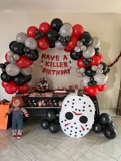 a halloween themed party with balloons and decorations