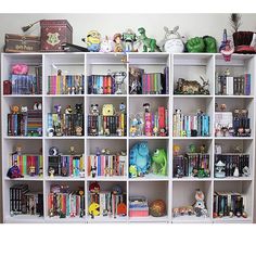 a white book shelf filled with lots of books