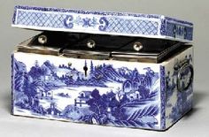 a blue and white box with an image of a landscape on the lid is shown