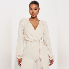 New With Tags | Comfort Meets Style With This Cute Jumpsuit That Goes With Everything From Weekend Brunch, A Night Out, Dinner Or Work | Features: V Neck Collar, Long Sleeve, Surpluce, Tie Waist, Wide Leg Pant | 100% Polyester | Color: Oatmeal | Size: Medium | Measurements (Approx): Bust: 36-37”, Waist: 28-29”, Hips: 39-40” Beige Jumpsuits And Rompers For Fall Loungewear, Elegant Beige Jumpsuits And Rompers For Loungewear, Cream Long Sleeve Jumpsuits And Rompers For Spring, Cream Long Sleeve Jumpsuits For Spring, Chic Beige Jumpsuits And Rompers For Brunch, Chic Beige Jumpsuits For Brunch, Cream Fitted Jumpsuits And Rompers For Work, Fitted Cream Jumpsuits And Rompers For Workwear, Fitted Cream Jumpsuit For Workwear