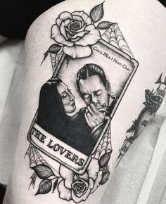 a man with a tattoo on his arm holding a rose and the words, the lovers