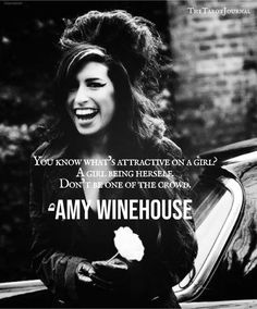 a woman standing next to a car with a quote about winehouse on the side