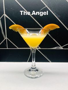 the angel cocktail is garnished with an orange slice