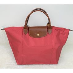 Brand New With Tag. Longchamp Le Pliage Medium Nylon Tote In Red This Guc Longchamp Arctic Red Medium Tote Is Comprised Of Embossed Leather That Borders A Durable Water Resistant Shell That Folds Neatly Into A Small Rectangle When Not In Use. It Has Dual Top Handles, A Top Zip Closure, Brand Logo Details, And A Beautifully Clean Interior. Zip Closure. Guc With Just A Couple Light Scuffs On Exterior And A Couple Small Ink Marks Inside. Perfect For Spring! Size: 18” X 11” X 7.5” Ships Next Busines Le Pliage Medium, Longchamp Le Pliage Medium, Longchamp Red, Longchamp Bags, Nylon Tote, Medium Tote, Medium Bags, Longchamp Le Pliage, Embossed Leather