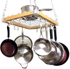 pots and pans are hanging from a rack