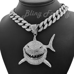 Silver Plated Alloy Iced Shark Pendant Cubic Zirconia Iced Cuban Chain Necklace HIP HOP CELEBRITY STYLE BRAND NEW USA SELLER Product Description Iced Cuban Chain : Chain Length : 16" 18" 20" Chain Width : 15mm Silver Plated over alloy Cubic Zirconia Stones Box Lock Pendant : Hip Hop Celebrity Style Pendant  SILVER PLATED OVER ALLOY SIZE OF PENDANT:  70mm x 60mm Cubic Zirconia Stones High Quality and polished. Payments: US Customers: Paypal accepted International Customers: Paypal accepted Shipping: For Shipping & Handling within the US: FREE We do combine shipping! We ship via USPS (Post office) First Class Mail Tracking Info will automatically be posted via Paypal and ebay. Approximate Delivery Times: US: 2-5 BUSINESS DAYS Canada: 1-2 weeks Europe: 1-6 weeks South America: 2 weeks Austral Most Expensive Jewelry, Shark Pendant, Dope Jewelry Accessories, Diamond Box, Cuban Chain Necklace, Silver Chain For Men, Online Products, Bling Necklace, Dope Jewelry