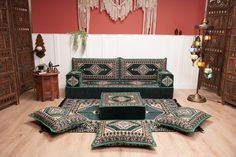 a living room filled with lots of furniture on top of a hard wood floored floor