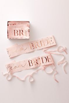 two bride and groom sashes on top of each other, one with the word'bridal'in cursive writing