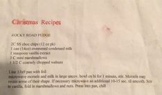 a recipe for christmas cookies on a piece of white paper with red writing that reads, christmas recipes rocky road fudge