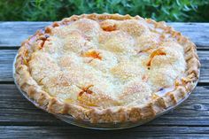 a pie sitting on top of a wooden table