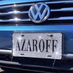 a blue volkswagen car with the word azaroff on it's license plate