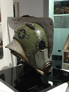 a helmet is on display in a museum