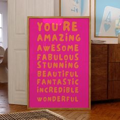 there is a pink sign that says you're amazing