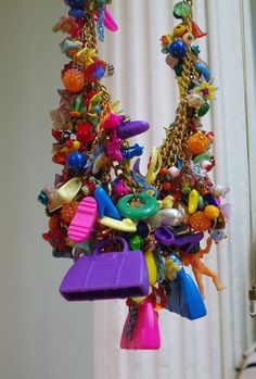 a bunch of toys that are hanging from a hook