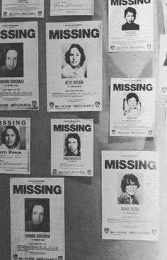 several missing posters are posted on the wall