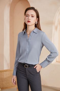 A soft and luxurious silk shirt. The shirt has a classic shirt collar, long sleeves, and front button closure. Along with this it features buttons at the cuffs as well. The straight silhouette of this garment makes it perfect for professional dress codes as well as casual settings. Unlined. Semi-formal Sleek Collared Blouse, Solid Long Sleeve Blouse With Placket, Collared Neckline Shirt For Office Wear In Fall, Collared Shirt For Office Wear In Fall, Long Sleeve Blouse With Button Cuffs For Office, Elegant Shirt With Hidden Button Closure For Office Wear, Long Sleeve Shirt With Button Cuffs For Office, Fall Office Wear Shirt With Collared Neckline, Business Casual Long Sleeve Blouse With Placket