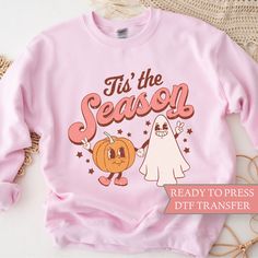 a pink sweatshirt that says tis the season ready to press dtt transferer on it