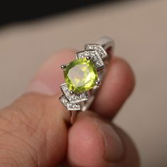 This is a gorgeous handmade creation. Its beauty is its simplicity & Elegance. The 7*7 mm cushion shape faceted natural peridot is crafted in solid sterling silver and with rhodium plated. All item is sent in a beautiful gift box If you have any idea of design your ring,pls contact me directly. You can realize more lovely stuff clicking the link https://www.etsy.com/shop/knightjewelry?refshopsection_shophome_leftnav Please leave the correct address and you phone number for delivering success Lime Green Diamond Ring With Gemstone, Lime Green Peridot Birthstone Ring For Promise, Lime Green Diamond Gemstone Rings, Peridot Diamond Ring With Round Cut, Peridot Round Cut Diamond Ring, Peridot Jewelry With Round Cut Accent Stones, Round Cut Peridot Jewelry With Accent Stones, Peridot Jewelry With Accent Stones In Round Cut, Lime Green Peridot Promise Ring