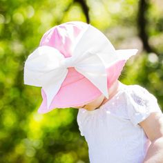 She's sweet, smart and ready for fun in the sun! The Candy Pink Stella Sun Hat is made of soft 100% cotton, is fully lined and features a sweet eyelet trim. Topped of with our exclusive Bow-Rae-Mi Appliqué in your choice of color.  100% Cotton Hand wash keeping appliqué dry, lay flat to dry Adjustable Velcro chin strap Generous fit keeps her comfortable in the hot sun SPF 50+ Sizes 3-12 m, 12-2y, 2-4y & 4&up. Recommended to size up if age is close to the next size or on the border. Size 4 and up Infant Sun Hat, Newborn Sun Hat, Toddler Sun Hat, Girls Sun Hat, Hat With Bow, Baby Sun Hat, Baby Flower