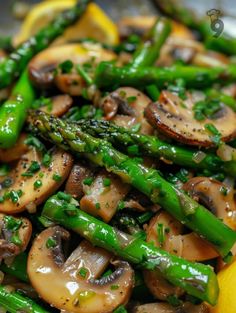 asparagus, mushrooms and lemon on a plate