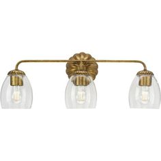 three light bathroom fixture with clear glass shades and brass finish, in an antique style