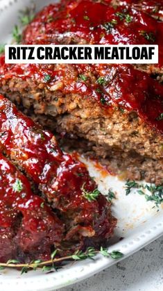 a meatloaf on a white plate with the words ritz cracker meatloaf