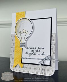 a handmade card with a light bulb on the front, and some words below it