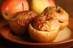 some apples that are sitting on a plate