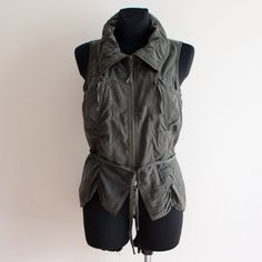 "Khaki Green Vest Tencel Vest Sleeveless Jacket Women's Khaki Top Long Vest Drawstring Cargo Vest  Y2K Vest Grunge Fit size: S/M Measurements (lying flat): Length(back): 24''/ 61 cm Bust: 18.5''/ 47 cm Waist: 16.5\"/ 42 cm   Please check measurements to insure a proper fit. Remember to allow yourself some extra room for movement. You can compare these with something from your closet that fits you well. Please convo me if you need additional measurements. Condition: Great Vintage Condition. Materials: 100% tencel. SHIPPING * I ship worldwide via Priority mail (Latvijas Pasts) from Latvia (EU). * Items are shipped 1 - 3 business days after receiving the payment. * Friday night orders and Saturday orders are sent Monday morning. * I ship from Europe, so please allow 2 to 3 weeks for the packa Stretch Sleeveless Vest With Pockets, Military Style Khaki Vest For Winter, Khaki Sleeveless Winter Vest, Stretch Sleeveless Vest For Outdoor, Fitted Military Style Winter Tops, Sleeveless Military Outerwear, Fitted Khaki Vest For Winter, Winter Utility Nylon Vest, Military Style Sleeveless Cotton Vest