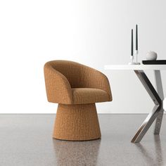 a modern chair and table in an empty room